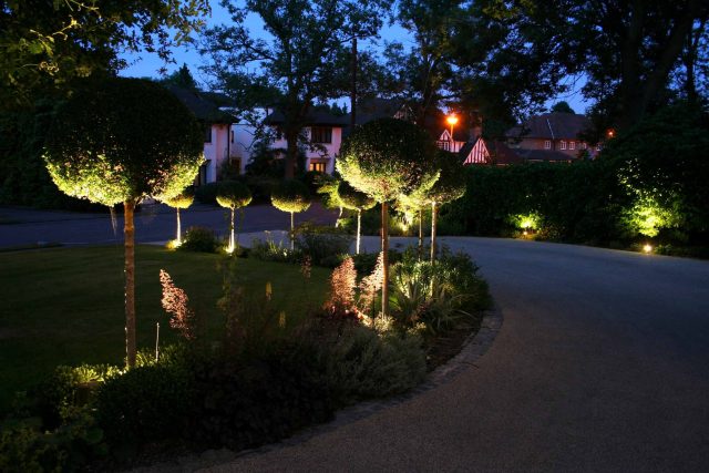Gerrards Cross Garden Designer Romantic elegant terrace contemporary garden with manicured wide lawn in Northwood West London, striking bespoke cedar pergola.