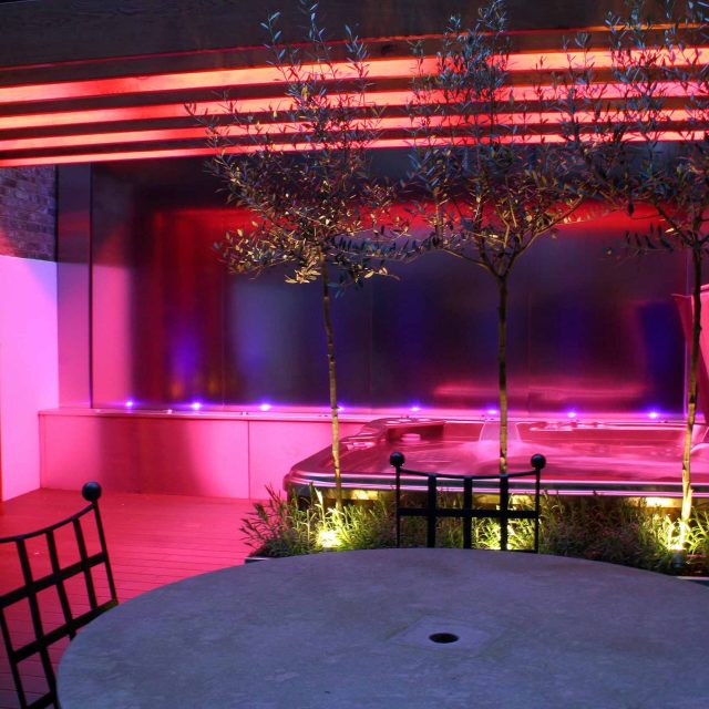 Outdoor hot tub and waterwall Garden Designs Plan Build in Central London Water feature constructed on-site along with the rear steel framework Highly Commended.