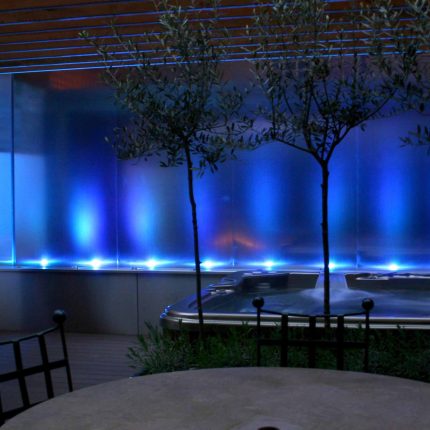 Outdoor hot tub and waterwall Garden Designs Plan Build in Central London Water feature constructed on-site along with the rear steel framework Highly Commended.