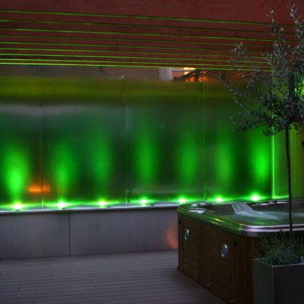 Outdoor hot tub and waterwall Garden Designs Plan Build in Central London Water feature constructed on-site along with the rear steel framework Highly Commended.