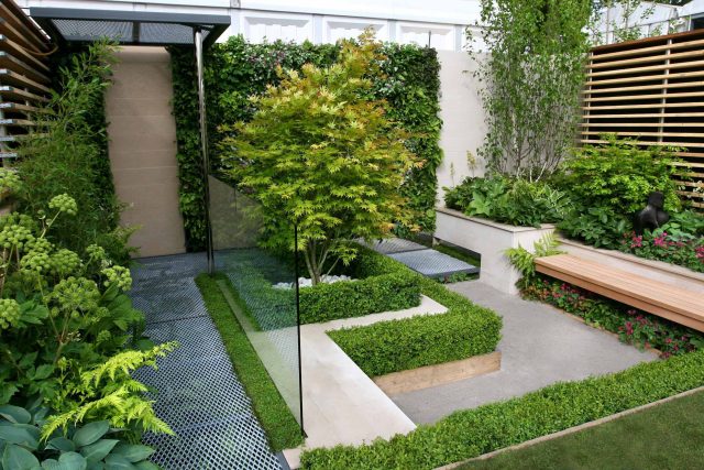 Award Winning Eco Chic Garden RHS Gold Medal 09 designed by Kate Gould constructed by The Garden Builders Chelsea Flower Show 2009 pergola hedging shrubs.
