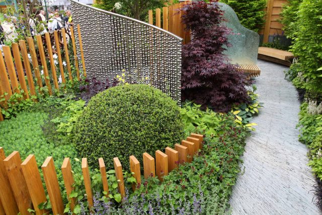 Award winning garden 2013 RHS Silver Gilt Medal at Chelsea Flower Show Garden, The Garden Builders Darren Hawkes Designer, opaque glass screens, steel balls.