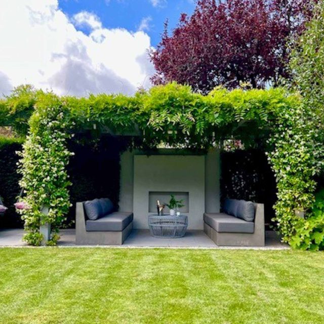Garden design Wandsworth a medium size garden is divided into three main areas of an urban retreat offering multiple options for relaxation outdoor fireplace.