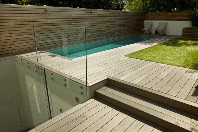 Lane swimming pool and contemporary garden designed and built by The Garden Builders Fulham London SW6, symmetry with the pool strategically planted pockets.