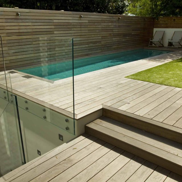 Lane swimming pool and contemporary garden designed and built by The Garden Builders Fulham London SW6, symmetry with the pool strategically planted pockets.