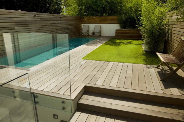 Lane swimming pool and contemporary garden designed and built by The Garden Builders Fulham London SW6, symmetry with the pool strategically planted pockets.