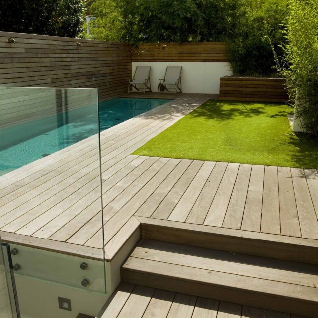 Lane swimming pool and contemporary garden designed and built by The Garden Builders Fulham London SW6, symmetry with the pool strategically planted pockets.