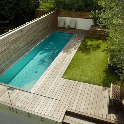 Lane swimming pool and contemporary garden designed and built by The Garden Builders Fulham London SW6, symmetry with the pool strategically planted pockets.