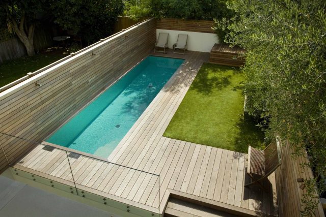 Lane swimming pool and contemporary garden designed and built by The Garden Builders Fulham London SW6, symmetry with the pool strategically planted pockets.