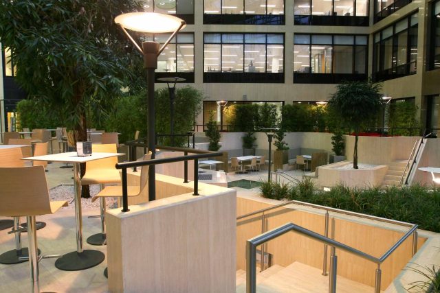 Commercial building contractors outdoor relaxation, seating dining area with Pringle Brandon Architects in Weybridge Surrey, hospitality roof garden company.