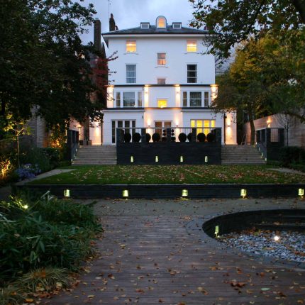 Stylish Formal Garden with terrace receives Highly Commended by Phil Frank in St John's Wood London slatted trellis panels gravel resin paths, children's play.
