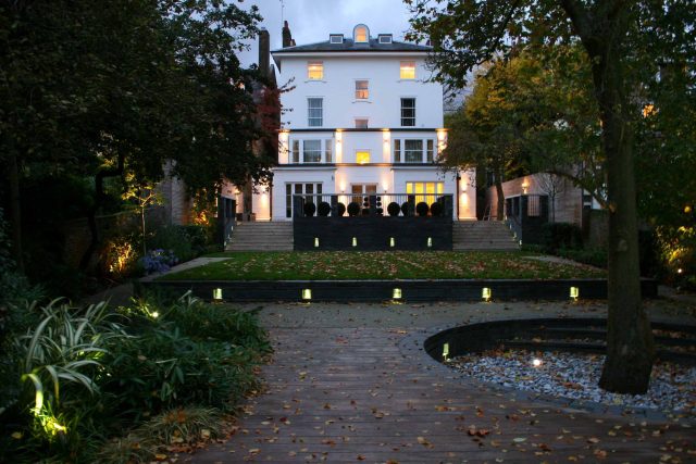 Stylish Formal Garden with terrace receives Highly Commended by Phil Frank in St John's Wood London slatted trellis panels gravel resin paths, children's play.