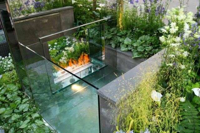 Award Winning RHS Silver Gilt Medal by Kate Gould, The Garden Builders RHS Chelsea Flower Show 2010, outdoor room, bio-gel fireplace, concrete chimney.
