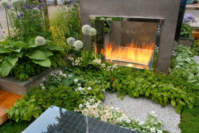 Award Winning RHS Silver Gilt Medal by Kate Gould, The Garden Builders RHS Chelsea Flower Show 2010, outdoor room, bio-gel fireplace, concrete chimney.
