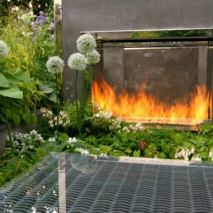 Award Winning RHS Silver Gilt Medal by Kate Gould, The Garden Builders RHS Chelsea Flower Show 2010, outdoor room, bio-gel fireplace, concrete chimney.