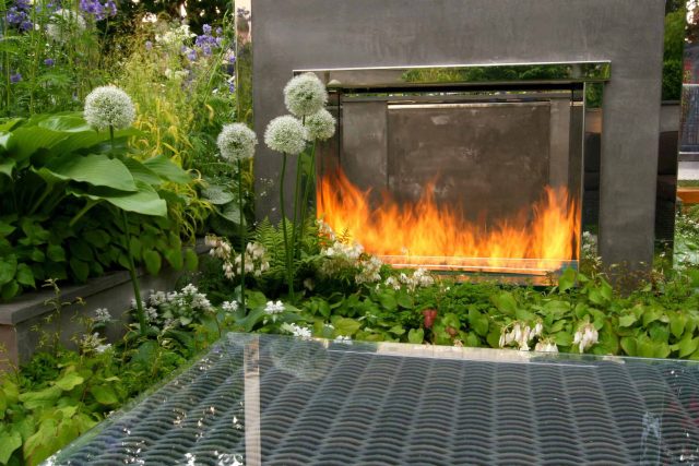 Award Winning RHS Silver Gilt Medal by Kate Gould, The Garden Builders RHS Chelsea Flower Show 2010, outdoor room, bio-gel fireplace, concrete chimney.