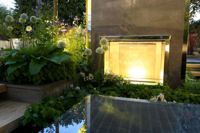 Award Winning RHS Silver Gilt Medal by Kate Gould, The Garden Builders RHS Chelsea Flower Show 2010, outdoor room, bio-gel fireplace, concrete chimney.