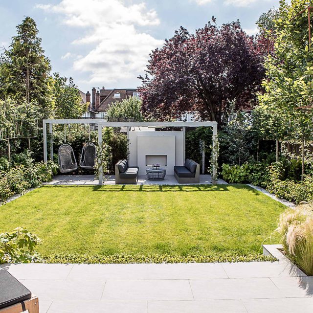 Garden design Wandsworth a medium size garden is divided into three main areas of an urban retreat offering multiple options for relaxation outdoor fireplace.