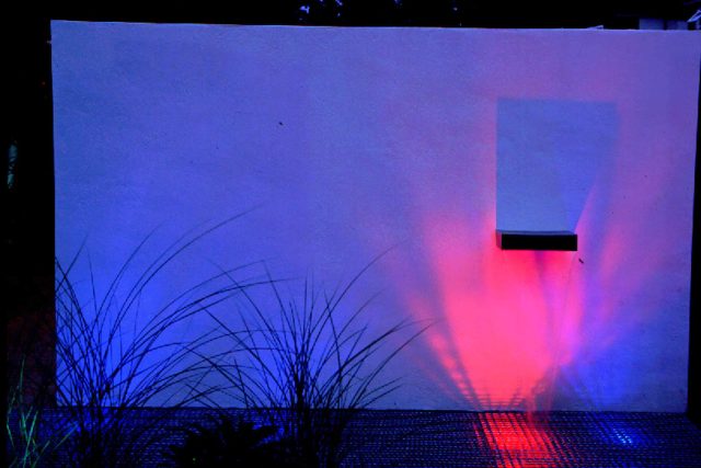Pool Contemporary Design Landscaping Large rendered walls, metal screening, and cedar decking by Paul Dracott in Barnes West London, consisting sleek design.