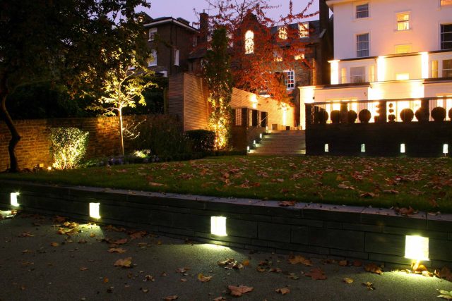 Stylish Formal Garden with terrace receives Highly Commended by Phil Frank in St John's Wood London slatted trellis panels gravel resin paths, children's play.