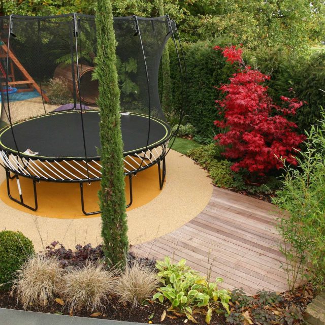 Children's Play Area Garden Design 51 APL Awards 11 The Garden Builders, Hersham, Surrey, featuring a slide, playhouse, trampoline, swings, sand pit, tunnel.