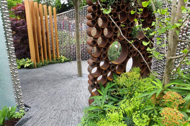 Award winning garden 2013 RHS Silver Gilt Medal at Chelsea Flower Show Garden, The Garden Builders Darren Hawkes Designer, opaque glass screens, steel balls.