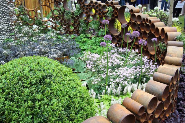 Award winning garden 2013 RHS Silver Gilt Medal at Chelsea Flower Show Garden, The Garden Builders Darren Hawkes Designer, opaque glass screens, steel balls.