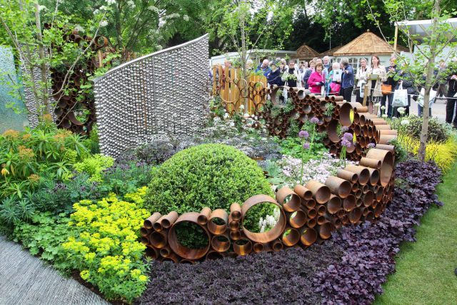 Award winning garden 2013 RHS Silver Gilt Medal at Chelsea Flower Show Garden, The Garden Builders Darren Hawkes Designer, opaque glass screens, steel balls.