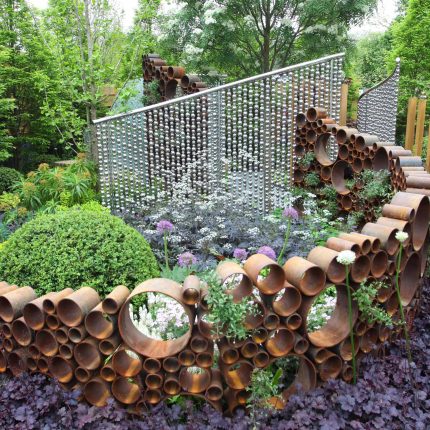 Award winning garden 2013 RHS Silver Gilt Medal at Chelsea Flower Show Garden, The Garden Builders Darren Hawkes Designer, opaque glass screens, steel balls.