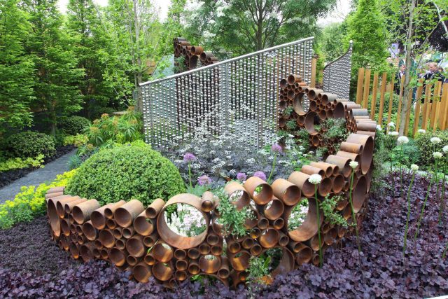 Award winning garden 2013 RHS Silver Gilt Medal at Chelsea Flower Show Garden, The Garden Builders Darren Hawkes Designer, opaque glass screens, steel balls.