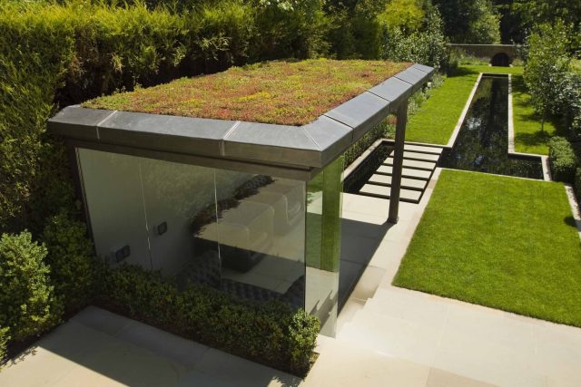 Stunning Suburban Garden constructed in Hampstead by Lynne Marcus also with Hunza exterior lighting illuminates asymmetrical landscape design, stone terrace.