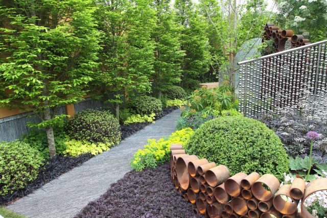 Award winning garden 2013 RHS Silver Gilt Medal at Chelsea Flower Show Garden, The Garden Builders Darren Hawkes Designer, opaque glass screens, steel balls.