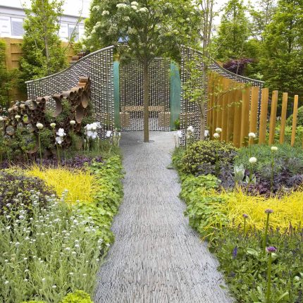 Award winning garden 2013 RHS Silver Gilt Medal at Chelsea Flower Show Garden, The Garden Builders Darren Hawkes Designer, opaque glass screens, steel balls.