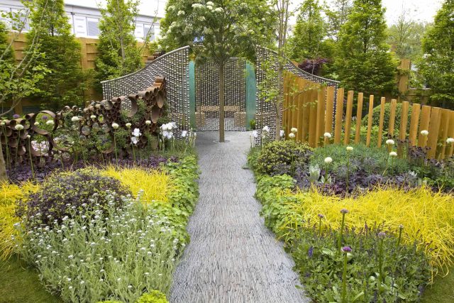 Award winning garden 2013 RHS Silver Gilt Medal at Chelsea Flower Show Garden, The Garden Builders Darren Hawkes Designer, opaque glass screens, steel balls.