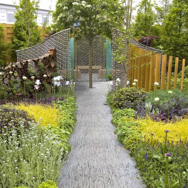 Award winning garden 2013 RHS Silver Gilt Medal at Chelsea Flower Show Garden, The Garden Builders Darren Hawkes Designer, opaque glass screens, steel balls.