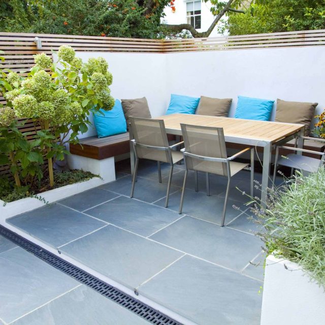 Contemporary small family garden designers in Clapham SW4 slate paving by Garden Builders London contractors near me, multi-purpose outdoor space, slate paving.