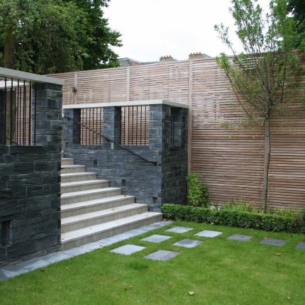 Stylish Formal Garden with terrace receives Highly Commended by Phil Frank in St John's Wood London slatted trellis panels gravel resin paths, children's play.