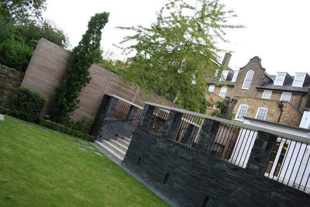Stylish Formal Garden with terrace receives Highly Commended by Phil Frank in St John's Wood London slatted trellis panels gravel resin paths, children's play.