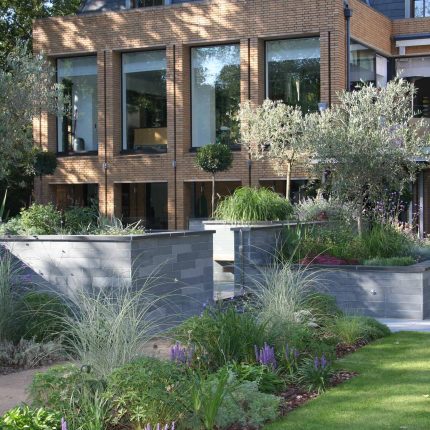 Stunning Family Garden designers Surrey APL Awards 09 Lynne Marcus Garden Design in Kingston Surrey Greater London area, water feature, sculptures, planting.