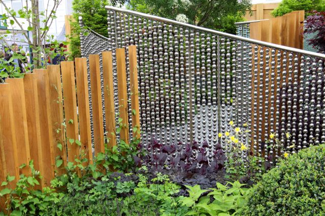 Award winning garden 2013 RHS Silver Gilt Medal at Chelsea Flower Show Garden, The Garden Builders Darren Hawkes Designer, opaque glass screens, steel balls.