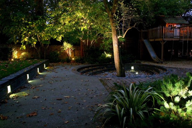 Stylish Formal Garden with terrace receives Highly Commended by Phil Frank in St John's Wood London slatted trellis panels gravel resin paths, children's play.