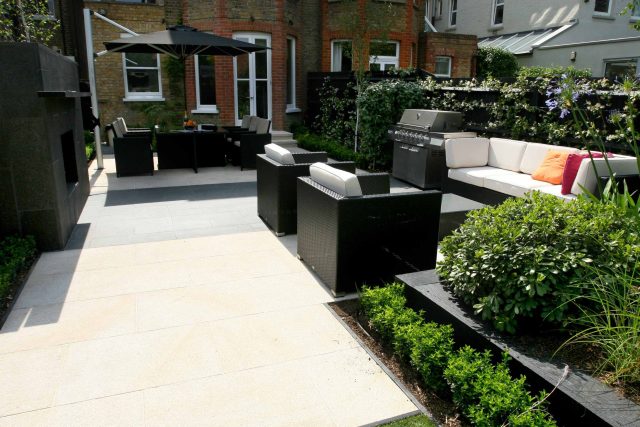 Family garden Barnes receives Highly Commended at Garden Design award with Declan Buckley in London, multi-functional outdoor environment cooking, dining, play.