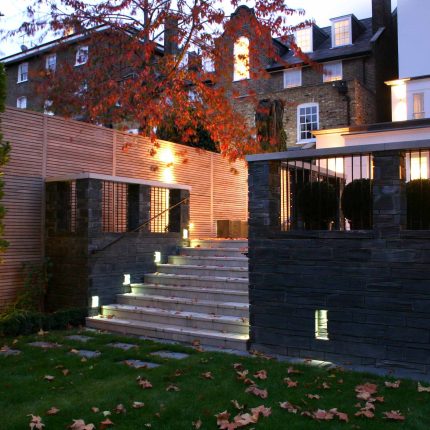 Stylish Formal Garden with terrace receives Highly Commended by Phil Frank in St John's Wood London slatted trellis panels gravel resin paths, children's play.