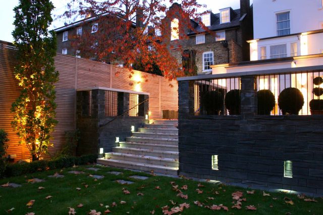 Stylish Formal Garden with terrace receives Highly Commended by Phil Frank in St John's Wood London slatted trellis panels gravel resin paths, children's play.