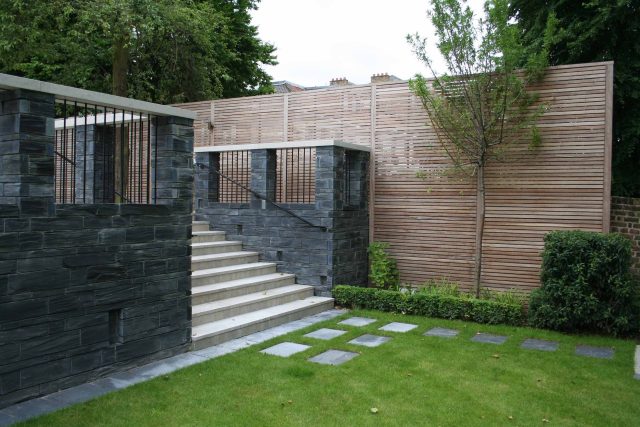 Stylish Formal Garden with terrace receives Highly Commended by Phil Frank in St John's Wood London slatted trellis panels gravel resin paths, children's play.
