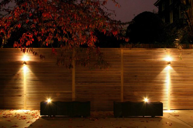 Stylish Formal Garden with terrace receives Highly Commended by Phil Frank in St John's Wood London slatted trellis panels gravel resin paths, children's play.