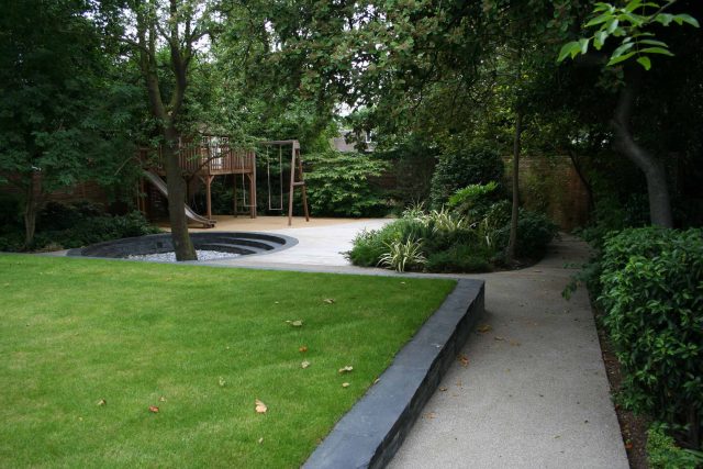 Stylish Formal Garden with terrace receives Highly Commended by Phil Frank in St John's Wood London slatted trellis panels gravel resin paths, children's play.