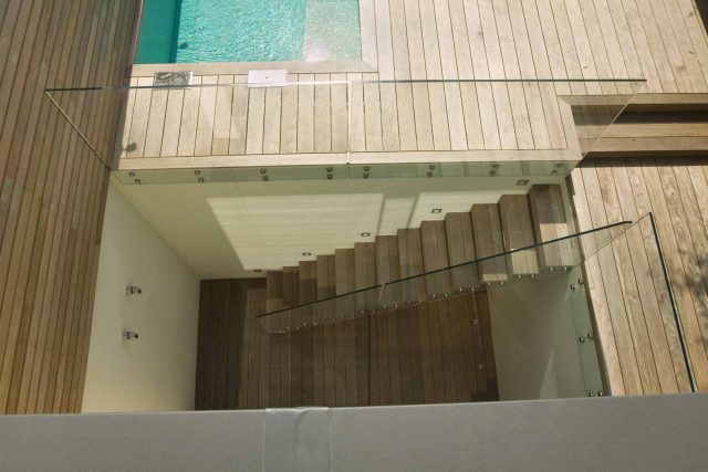 Lane swimming pool and contemporary garden designed and built by The Garden Builders Fulham London SW6, symmetry with the pool strategically planted pockets.