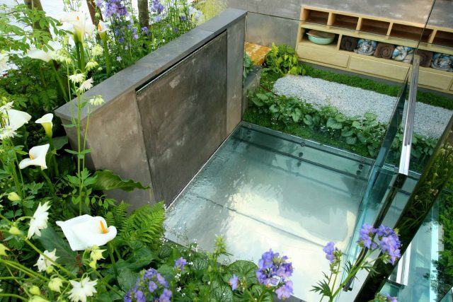 Award Winning RHS Silver Gilt Medal by Kate Gould, The Garden Builders RHS Chelsea Flower Show 2010, outdoor room, bio-gel fireplace, concrete chimney.