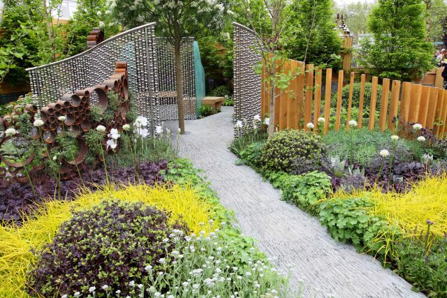 Award winning garden 2013 RHS Silver Gilt Medal at Chelsea Flower Show Garden, The Garden Builders Darren Hawkes Designer, opaque glass screens, steel balls.